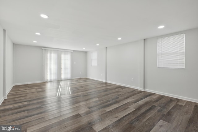 unfurnished room featuring dark wood-type flooring