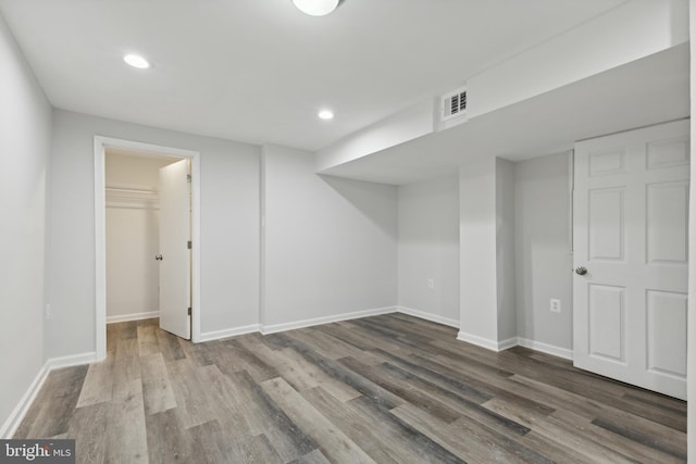 basement featuring hardwood / wood-style floors