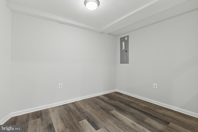 spare room with hardwood / wood-style flooring and electric panel