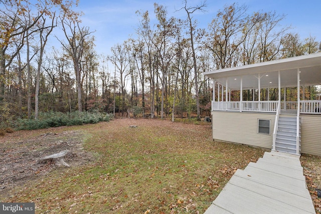 view of yard with covered porch