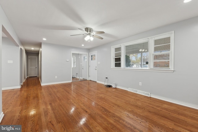 spare room featuring ceiling fan and wood-type flooring