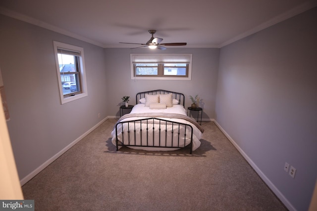 bedroom featuring carpet floors, ceiling fan, and crown molding