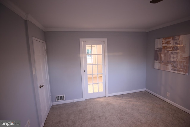 carpeted empty room with ornamental molding