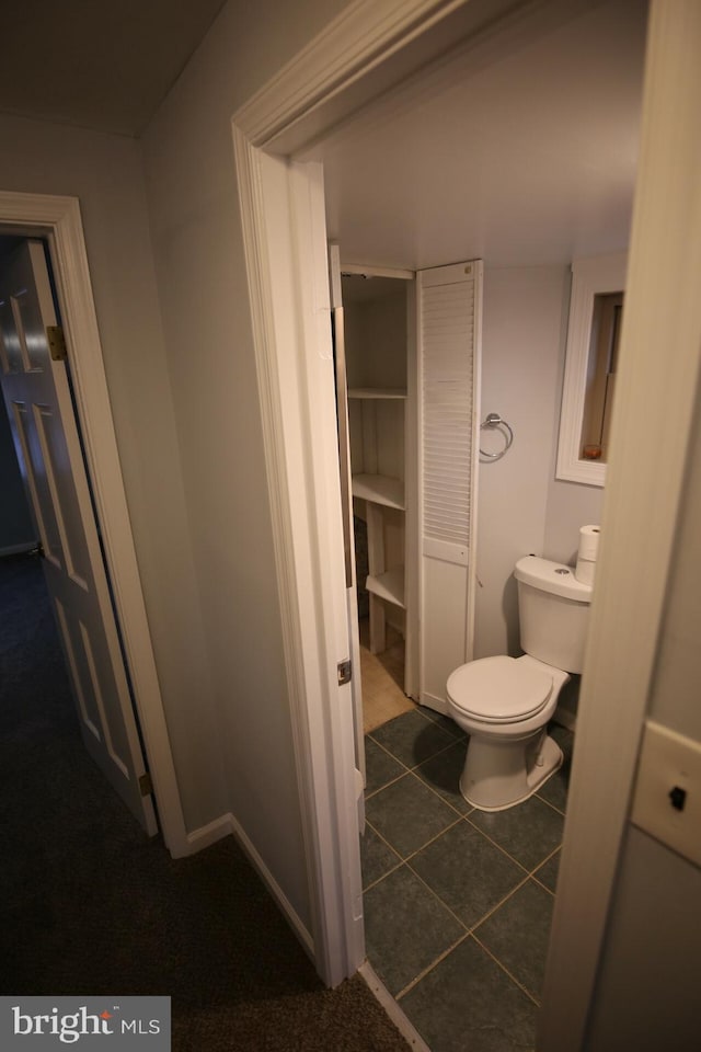 bathroom featuring tile patterned floors and toilet