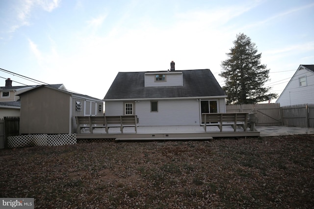 rear view of house with a wooden deck