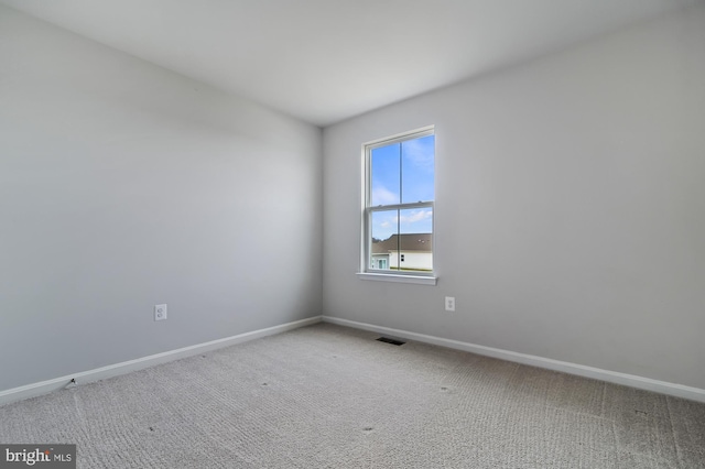 spare room featuring carpet