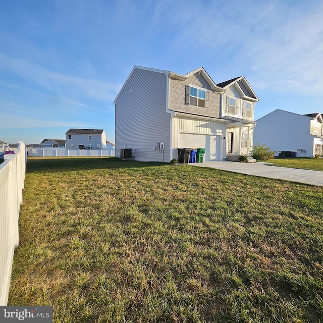 view of property exterior with a lawn, a garage, and central AC