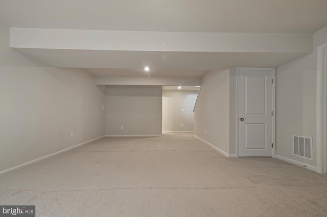 basement with light carpet