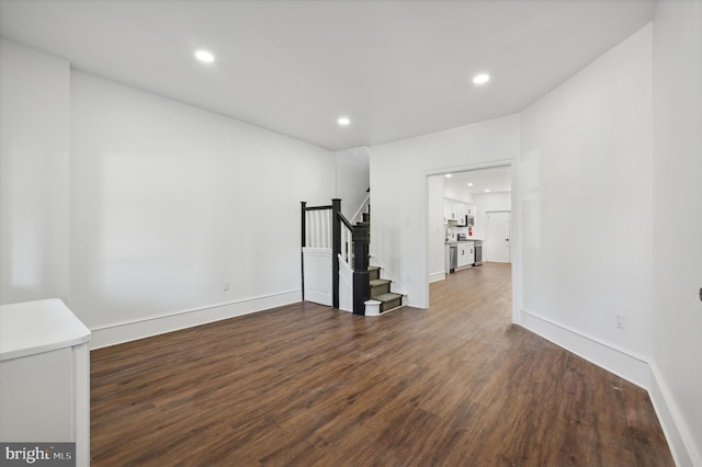 exercise room with dark wood-type flooring