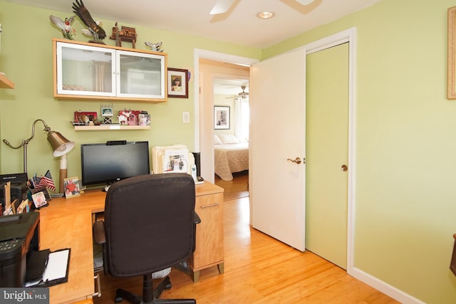 office space with ceiling fan and light wood-type flooring