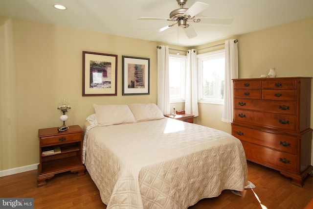 bedroom with ceiling fan and wood-type flooring