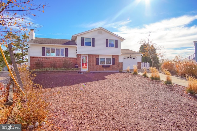 35 Walkill Rd, Little Egg Harbor Twp, NJ 08087 - split level home featuring a garage, brick siding, a chimney, driveway, and a shingled roof