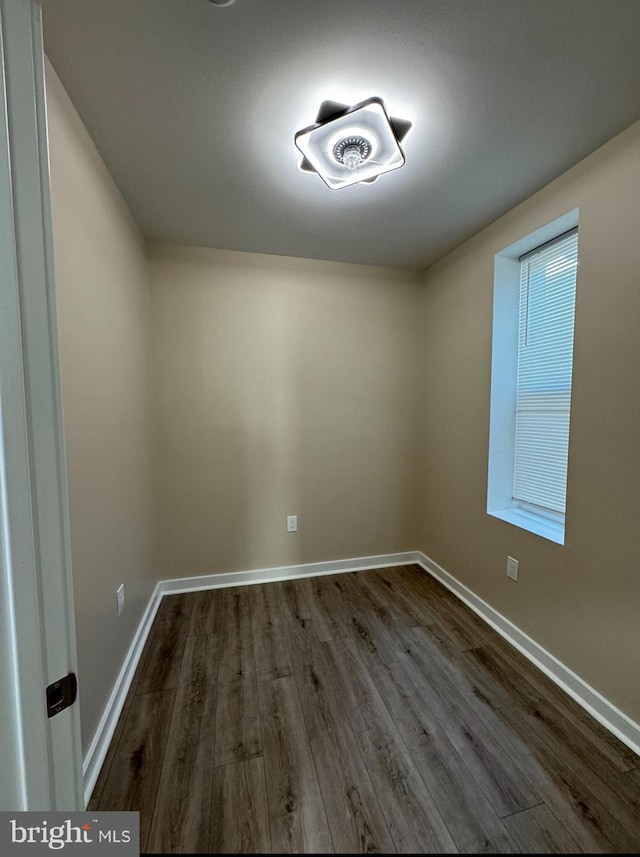 empty room featuring dark wood-type flooring