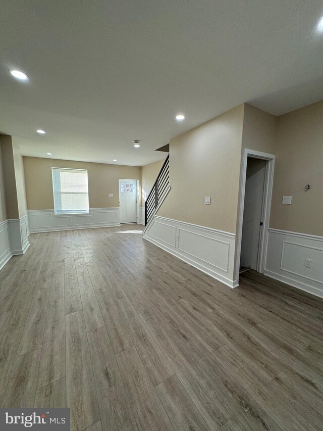 basement with hardwood / wood-style floors