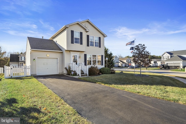 front facade with a garage and a front yard