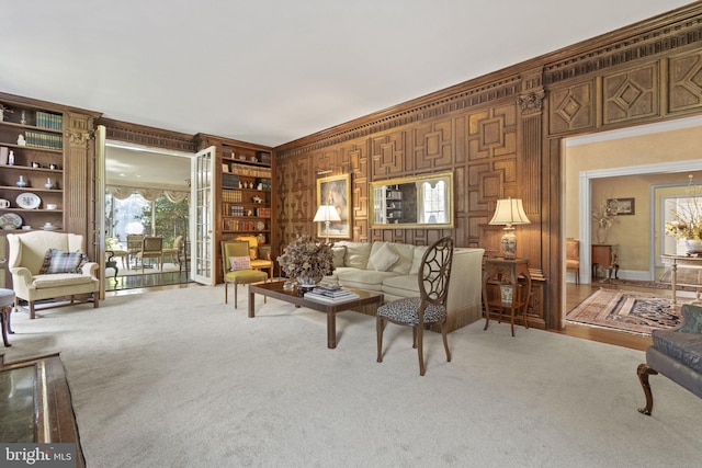 living room featuring carpet, built in shelves, and wood walls