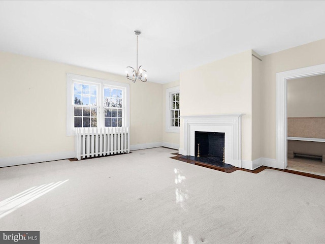 unfurnished living room featuring carpet flooring and an inviting chandelier