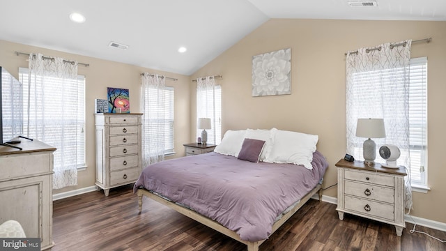 bedroom featuring dark wood-type flooring and lofted ceiling