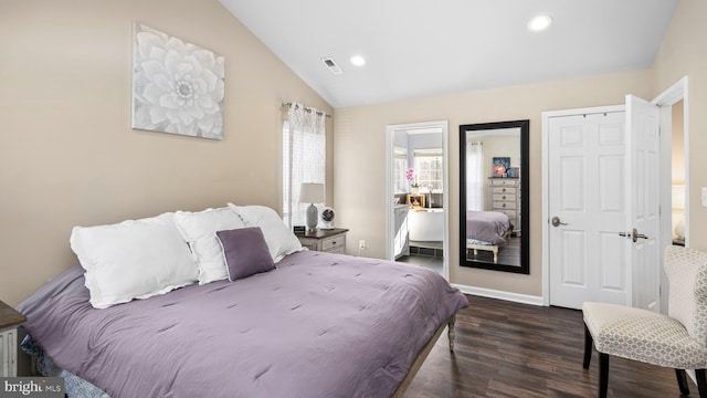 bedroom with a closet, dark wood-type flooring, and lofted ceiling