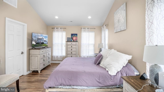 bedroom featuring lofted ceiling and dark wood-type flooring