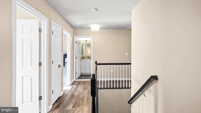 hall with dark hardwood / wood-style flooring