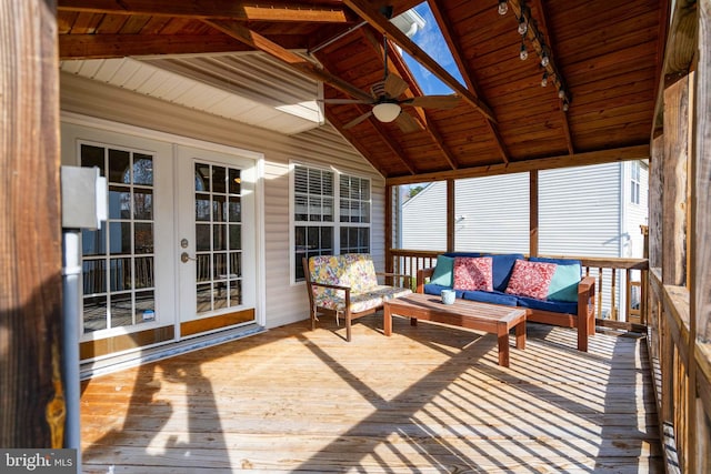 sunroom featuring wooden ceiling, french doors, lofted ceiling with beams, and track lighting