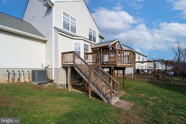 rear view of house featuring central AC, a yard, and a deck