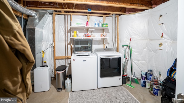 washroom with washer and dryer