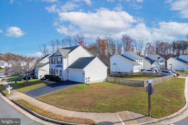 view of property exterior with a lawn and a garage