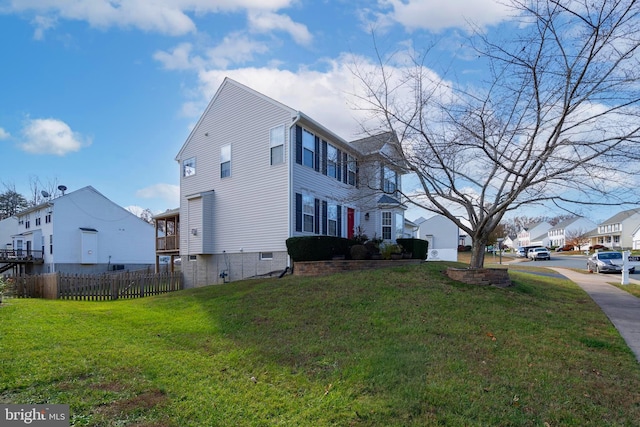 view of home's exterior featuring a yard