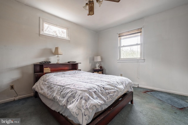 bedroom with ceiling fan and dark carpet