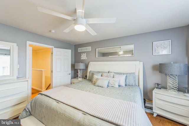 bedroom with hardwood / wood-style floors and ceiling fan