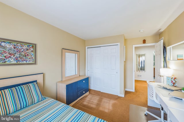 carpeted bedroom with a closet