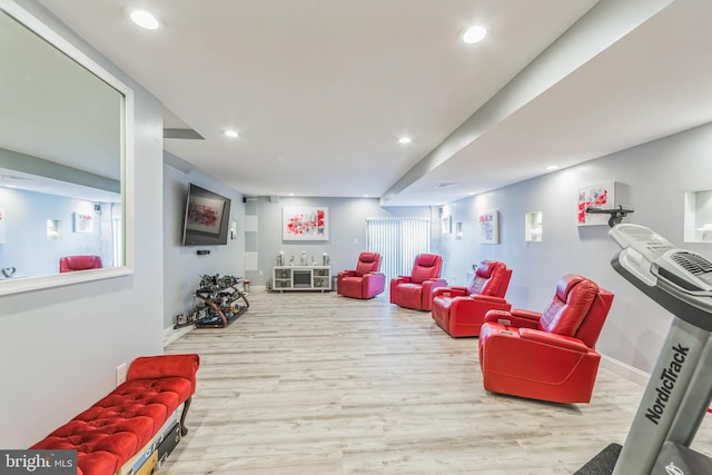 recreation room featuring plenty of natural light and light hardwood / wood-style floors