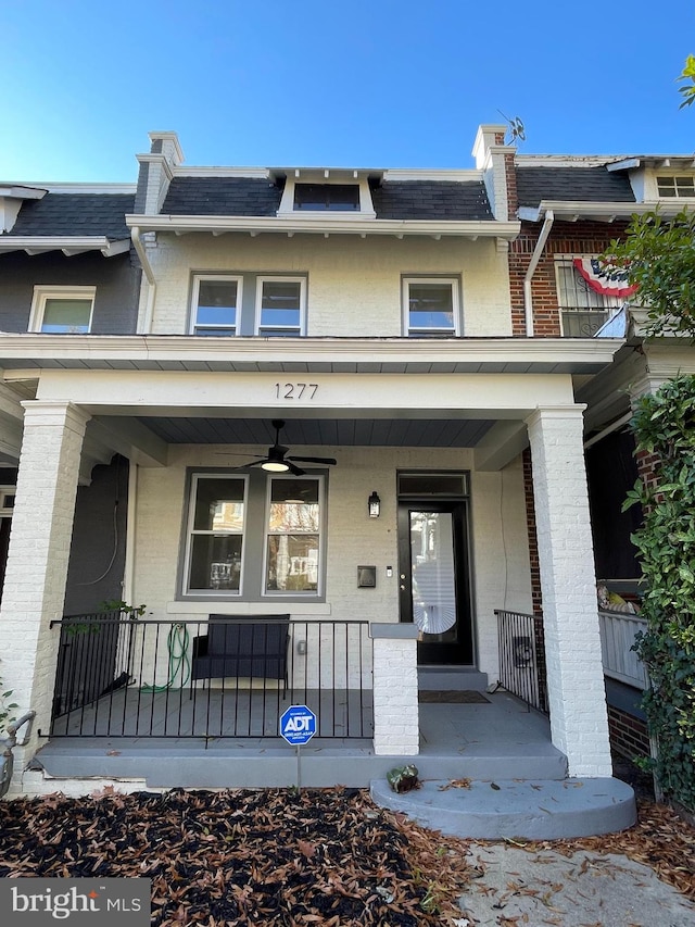 doorway to property with ceiling fan and covered porch