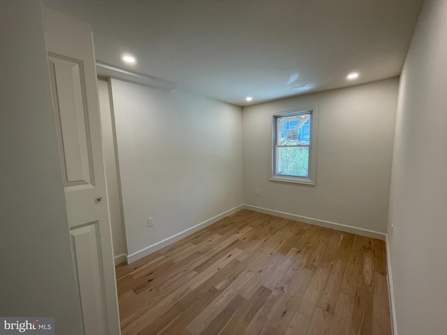 spare room with light hardwood / wood-style floors