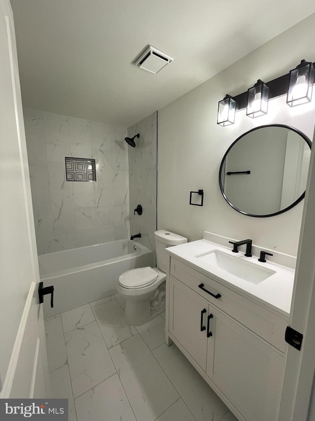 full bathroom featuring vanity, toilet, and tiled shower / bath