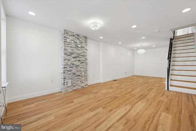 basement featuring light hardwood / wood-style floors