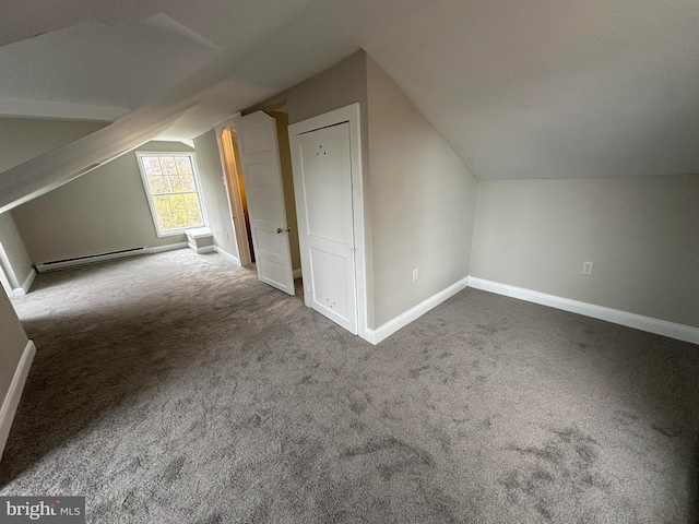 bonus room featuring baseboard heating, carpet floors, and vaulted ceiling