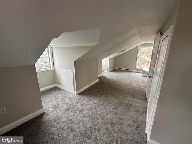 8579 Nursery Rd, Lusby, MD 20657 - additional living space with baseboard heating, lofted ceiling, carpet flooring, and baseboards