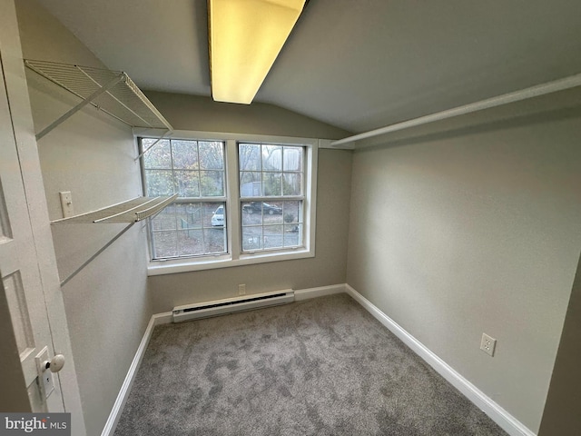 8579 Nursery Rd, Lusby, MD 20657 - walk in closet featuring baseboard heating, lofted ceiling, and carpet floors