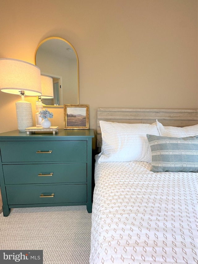 bedroom featuring light colored carpet