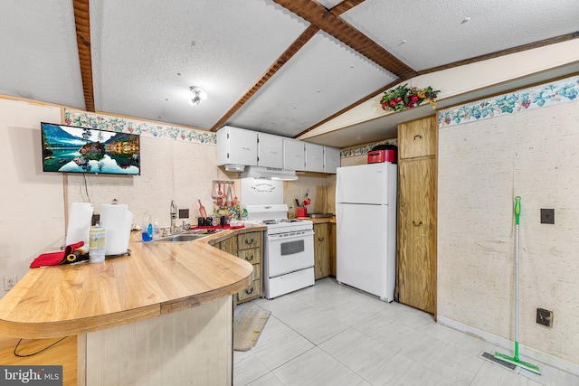 kitchen featuring white cabinetry, sink, vaulted ceiling with beams, kitchen peninsula, and white appliances