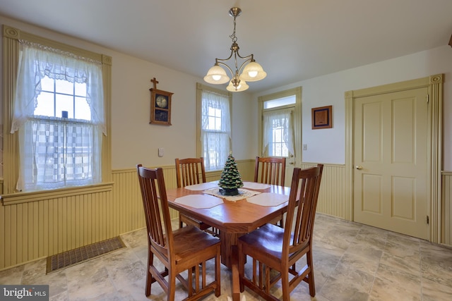 dining space with an inviting chandelier and a wealth of natural light