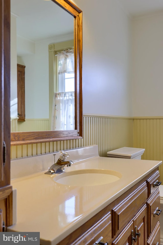 bathroom featuring vanity and toilet