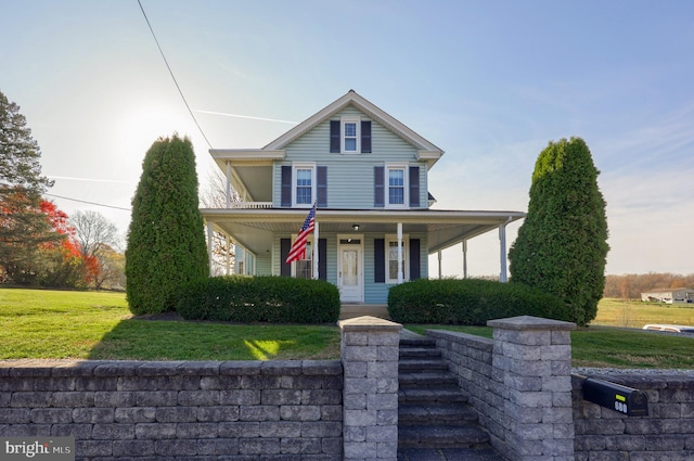 farmhouse-style home with a porch and a front lawn