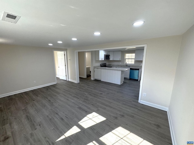 kitchen featuring white cabinetry, sink, dark hardwood / wood-style floors, and appliances with stainless steel finishes