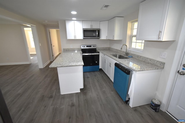 kitchen with white cabinets, dark hardwood / wood-style floors, sink, and stainless steel appliances