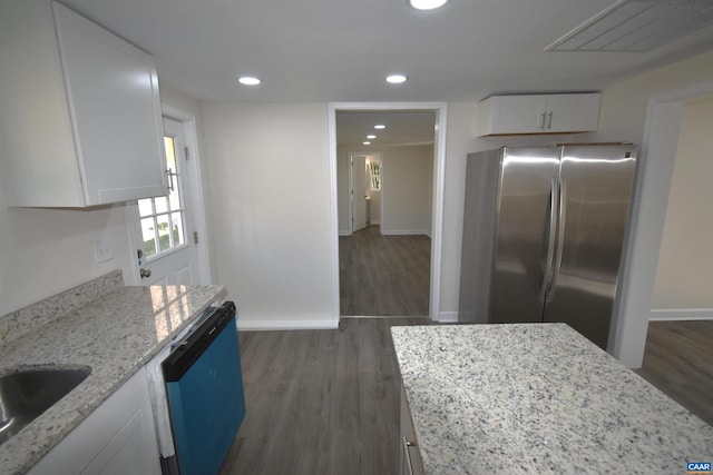 kitchen featuring stainless steel fridge, dishwasher, and white cabinets