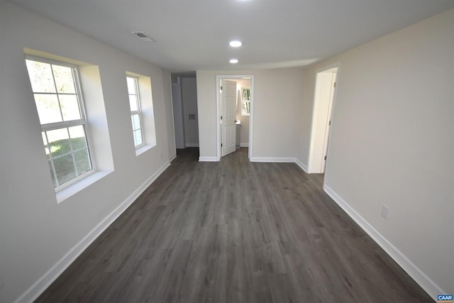 unfurnished room featuring dark hardwood / wood-style floors